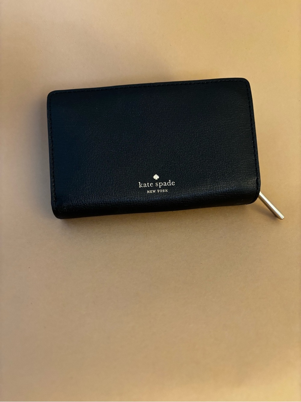 kate spade black leather zip-around wallet with gold-tone zipper pull